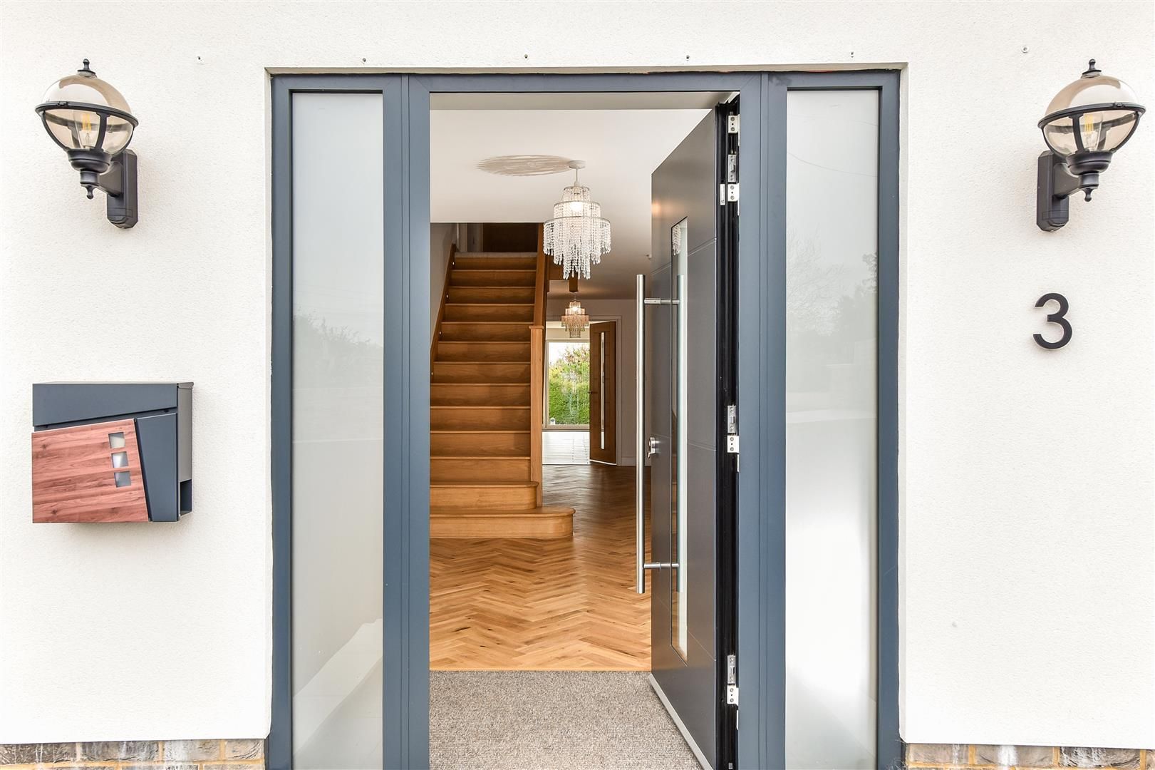 Listing photo — entrance hall and staircase